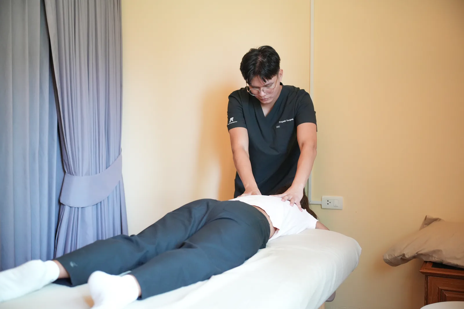 Dunk providing hands-on treatment in the clinic.