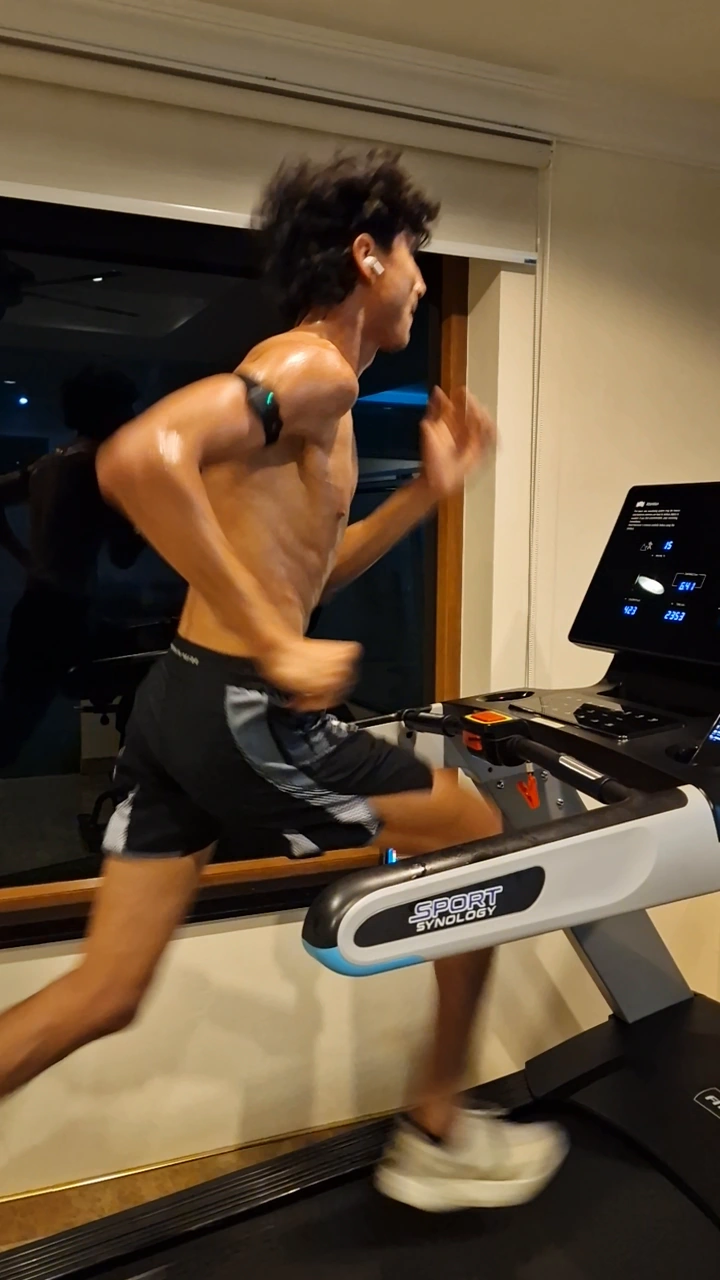 An athlete running on a treadmill during a conditioning session.