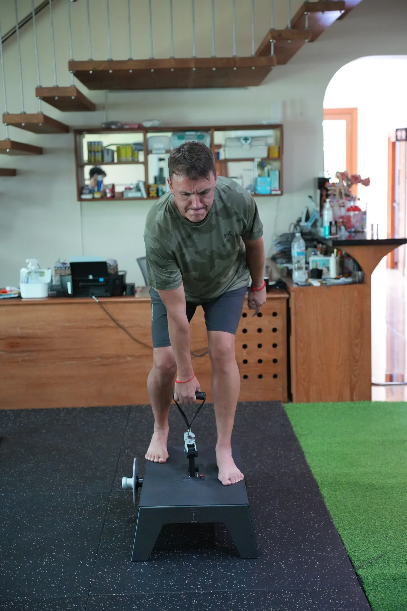An athlete performing a step exercise in the R&P gym.